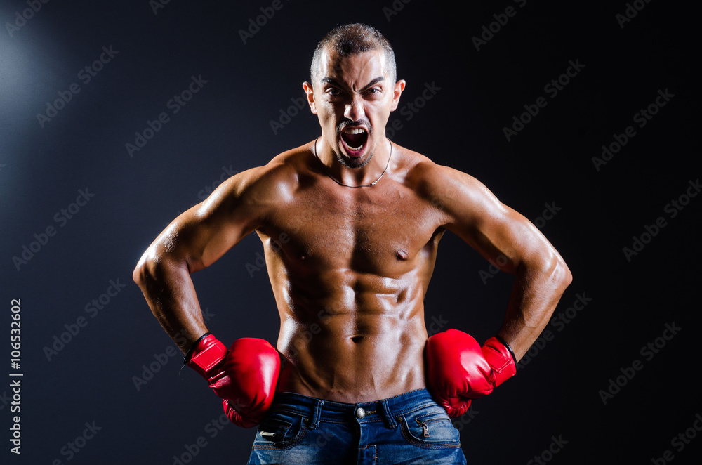 Ripped boxer in sports concept