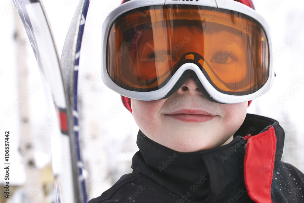 Caucasian boy wearing ski gear in snow Caucasian boy wearing ski gear in snow