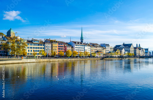 river limmat goes through the historic Zurich city center on a sunny day with clouds in autumn, Canton of Zurich, Switzerland