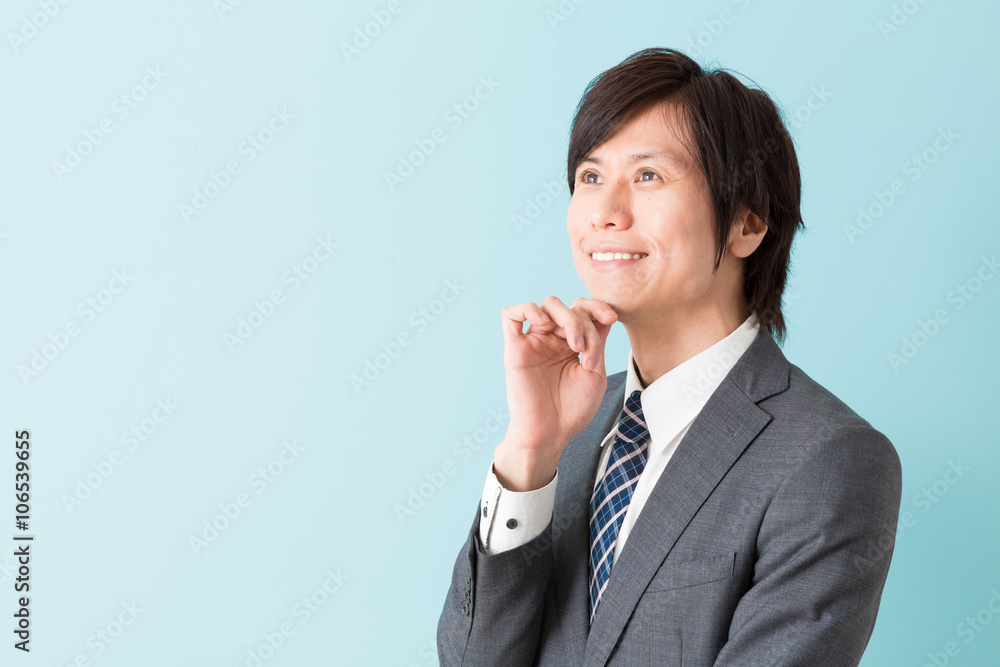 portrait of asian businessman on blue background portrait of asian businessman on blue background