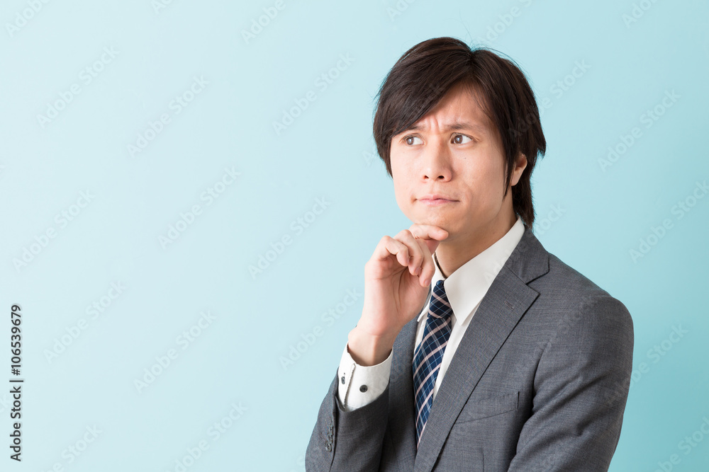 portrait of asian businessman on blue background portrait of asian businessman on blue background