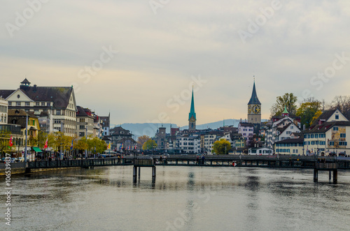 view of a riverside of the limmat river in swiss city zurich taken from the bahnhofbrucke bridge photo