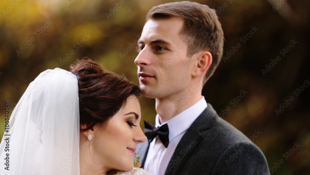 Close up of just married couple tenderly holding hands of each others. Close up of just married couple tenderly holding hands of each others.