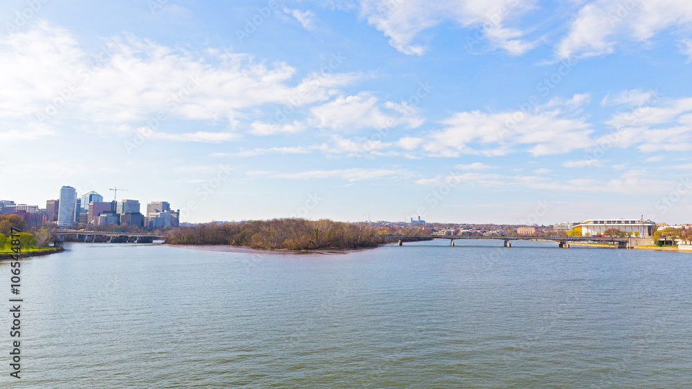 Panoramic view over Potomac river in Washington DC. Rosslyn skyline, the Key Bridge and Kennedy Center for the Performing Arts in spring.