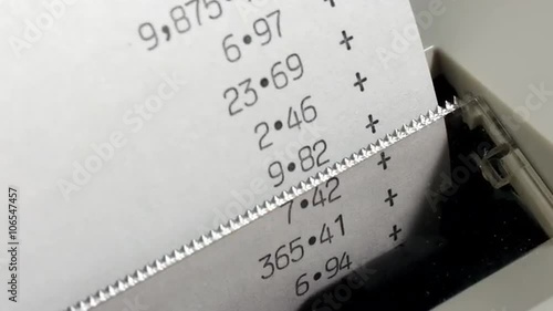 Fast moving office adding machine or calculator printout. Financial accounts and accounting. Time lapse zoom in.