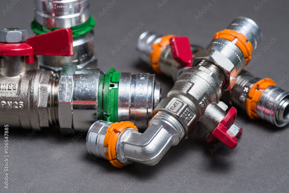 Water valves with fittings on grey Water valves with fittings on grey