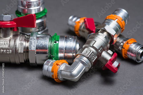 Water valves with fittings on grey