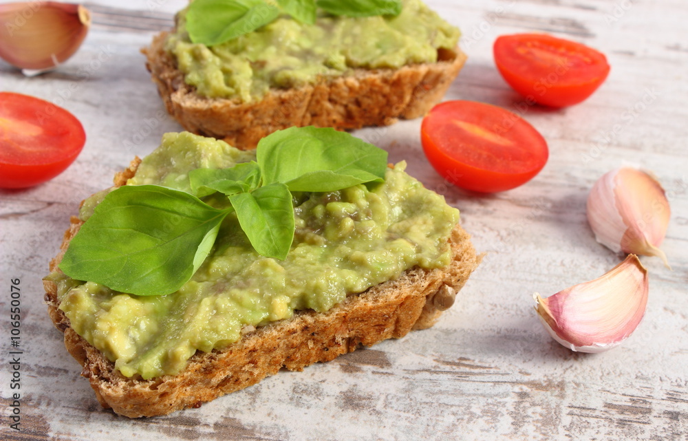 Freshly sandwiches with paste of avocado and ingredients, healthy food and nutrition Freshly sandwiches with paste of avocado and ingredients, healthy food and nutrition