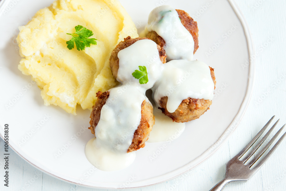 Meatballs with white creamy sauce