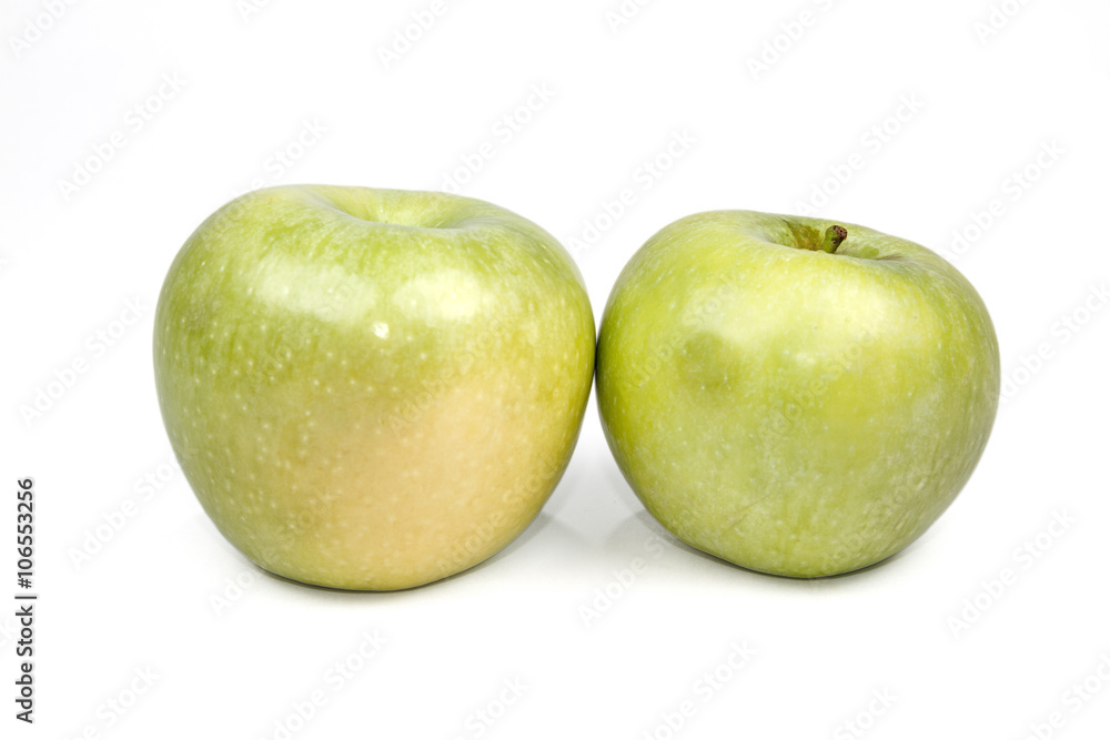 Whole green apple and half with leaf isolated on white backgroun Whole green apple and half with leaf isolated on white backgroun