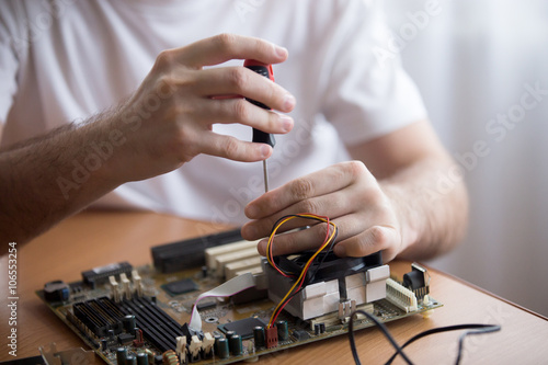 Hands of computer repairman