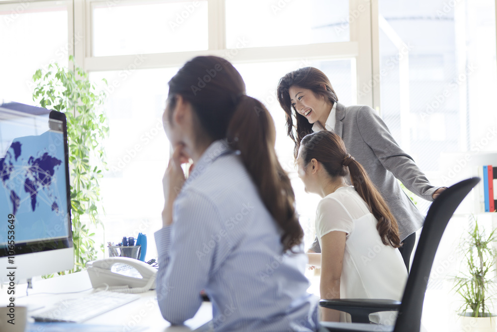 Business woman is looking at the map of the world on PC Business woman is looking at the map of the world on PC