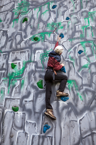 Boy climber on a wall