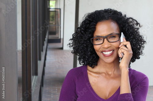 Tableau sur toile Middle-aged African woman talking on her cell phone