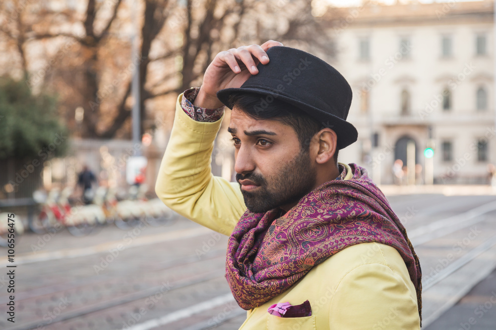 Indian handsome man posing in an urban context Indian handsome man posing in an urban context