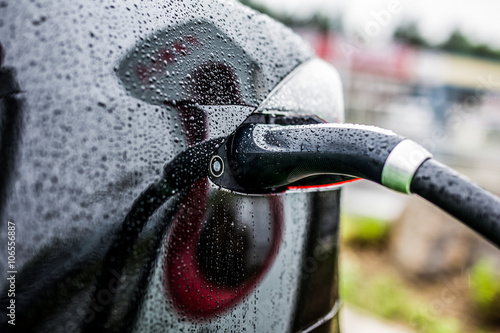 Electric car charging at electric petrol station - E-Mobility