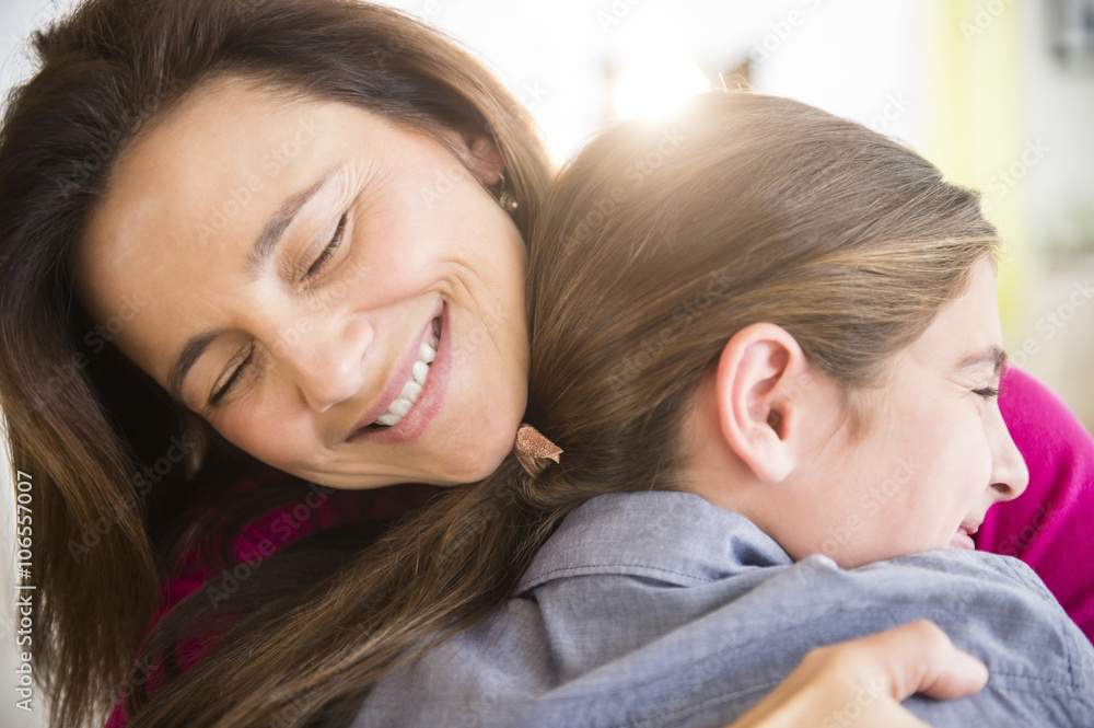Close up of Caucasian mother and daughter hugging Close up of Caucasian mother and daughter hugging