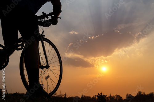 Fototapeta Naklejka Na Ścianę i Meble -  Silhouette of a bike on sky background on sunset