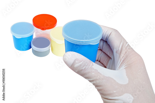Bild auf Leinwand blue urine container held by hand with other urine and sputum