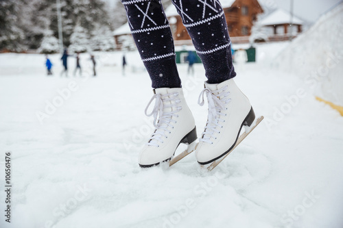 Female legs in ice skates