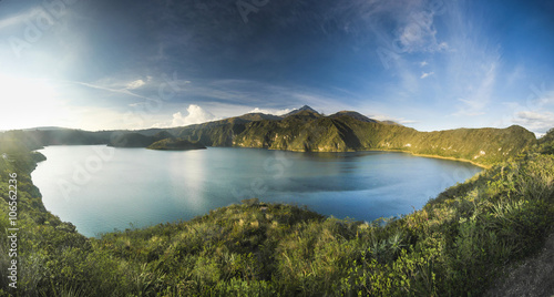 Obraz na plátne panorama of crater lake with two islands at sunset