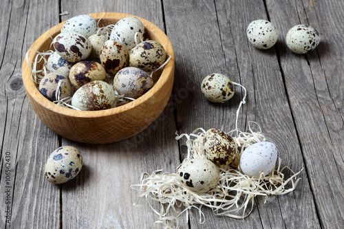 Quail eggs in a wooden bowl