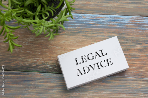 Legal Advice. Business card with message and flower. Office supplies on desk table top view