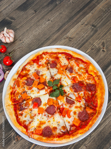 pizza with mushrooms, salami, vegetables