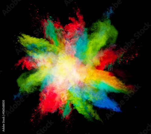 Explosion of colored powder on black background