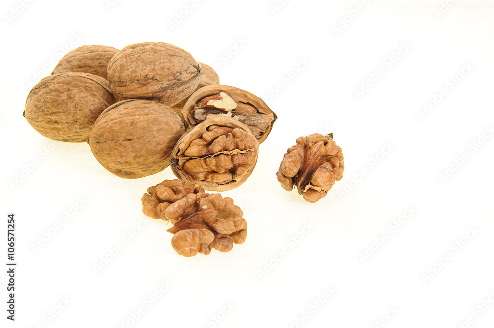 Walnut and walnut kernel isolated on the white background. Walnut and walnut kernel isolated on the white background.