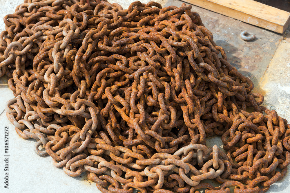 Close up of a rusty chain abandoned on the pier Close up of a rusty chain abandoned on the pier