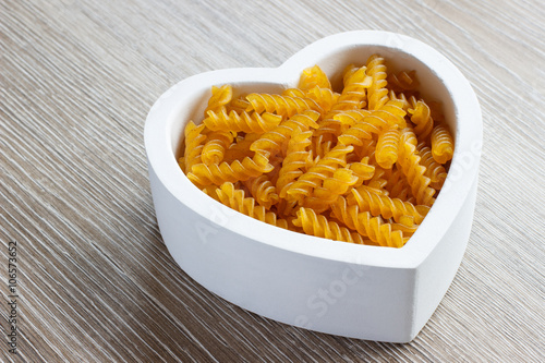 Heart filled with fusilli pasta