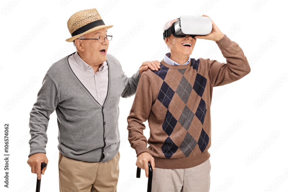 Two senior gentlemen using a VR headset Two senior gentlemen using a VR headset