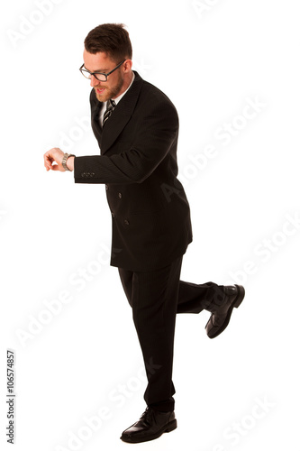 Successful businessman in formal suit chacking time on wrist wat photo