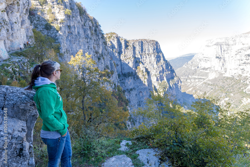 Young beautiful woman enjoying nature during a sunny day in the