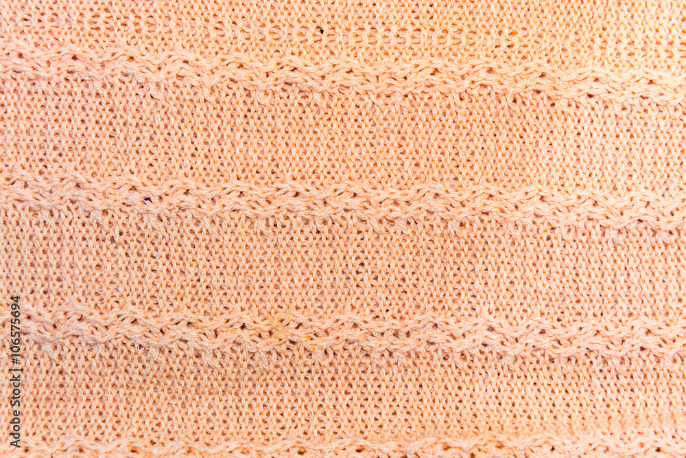 Fototapeta premium The background, texture of bright orange wool fabric with stripes