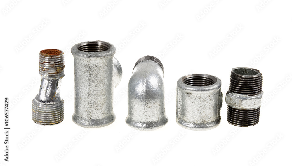 Galvanized plumbing parts on an isolated white background Galvanized plumbing parts on an isolated white background