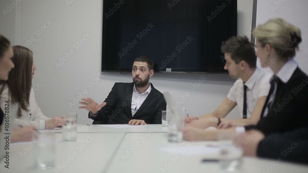Business team at a meeting: Group of business people discussing in the office. Slider camera movement Business team at a meeting: Group of business people discussing in the office. Slider camera movement