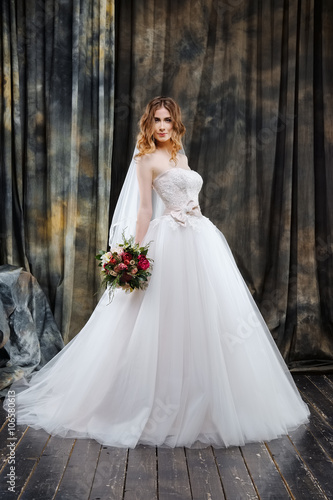 portrait of pretty bride in wedding dress