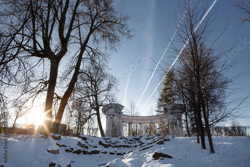 Colonnade of Apollo in Pavlovsk Park at sunset. Sanctuary of the Greek God of the sun and patron of arts. Historic architecture. Landscape Park Museum in Pavlovsk, Saint Petersburg.  Apollo Belvedere. photo