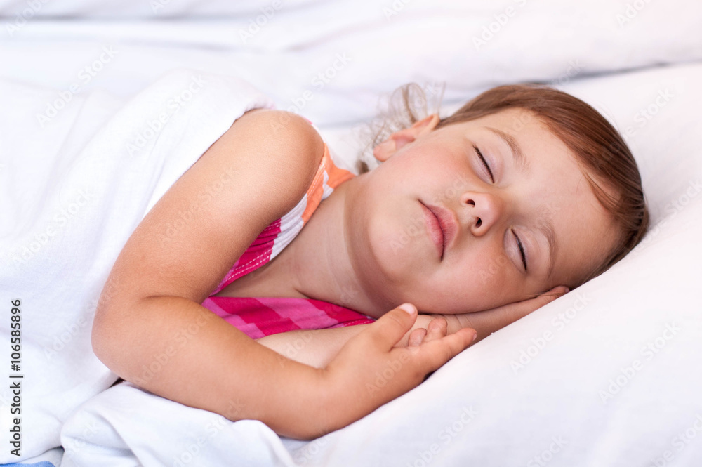 The child sleeps in bed The child sleeps in bed