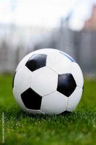 Football or soccer ball on grass 