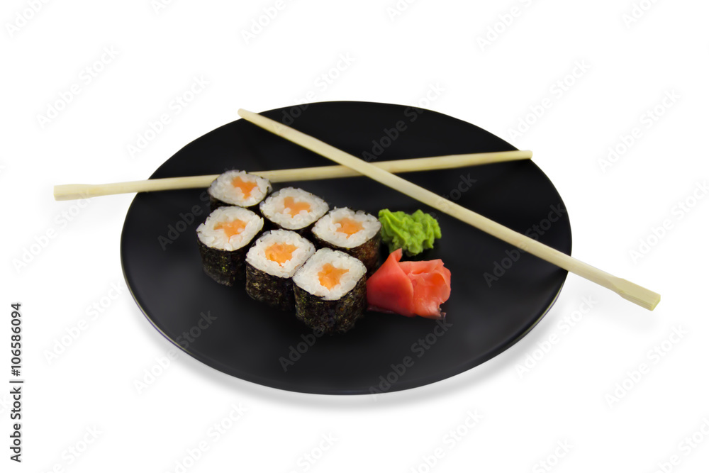 sushi roll with salmon on black plate sushi roll with salmon on black plate