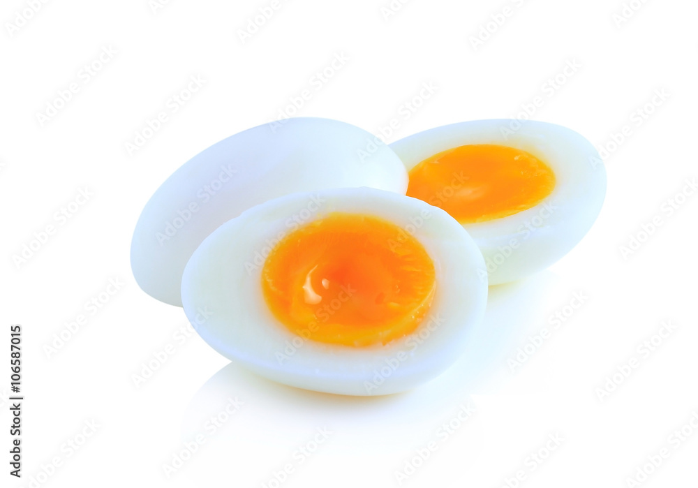 Boiled eggs cut in half isolated on white background. Boiled eggs cut in half isolated on white background.