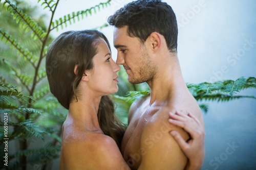 Young couple embracing in garden