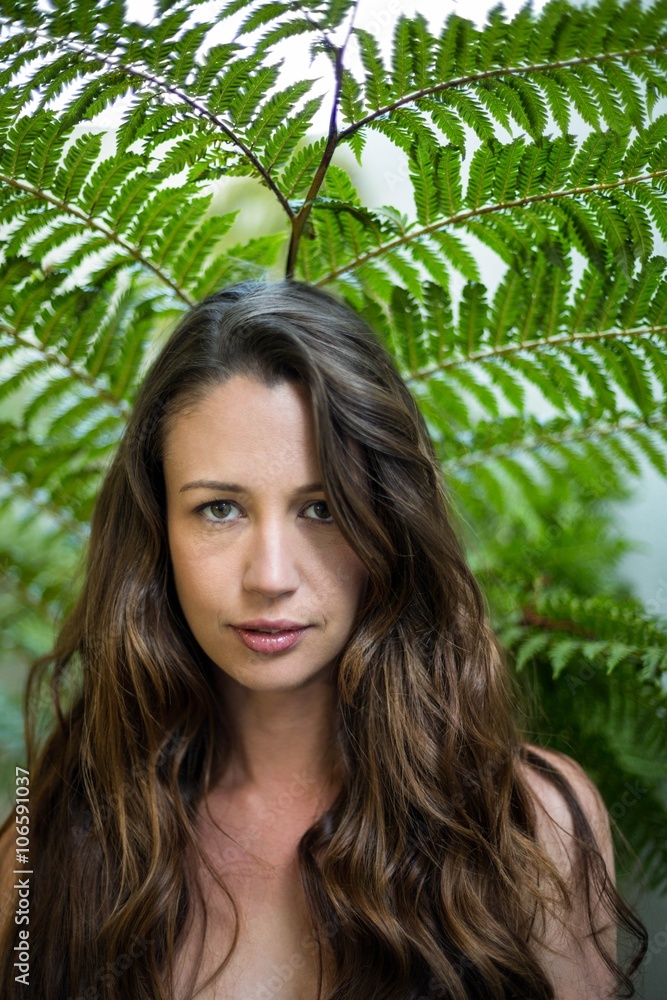 Portrait of beautiful woman standing outdoors in garden Portrait of beautiful woman standing outdoors in garden