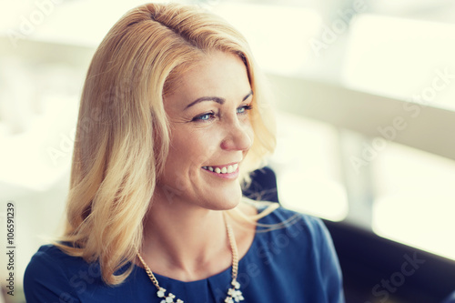 Fototapeta Naklejka Na Ścianę i Meble -  happy smiling blonde woman in blue clothes