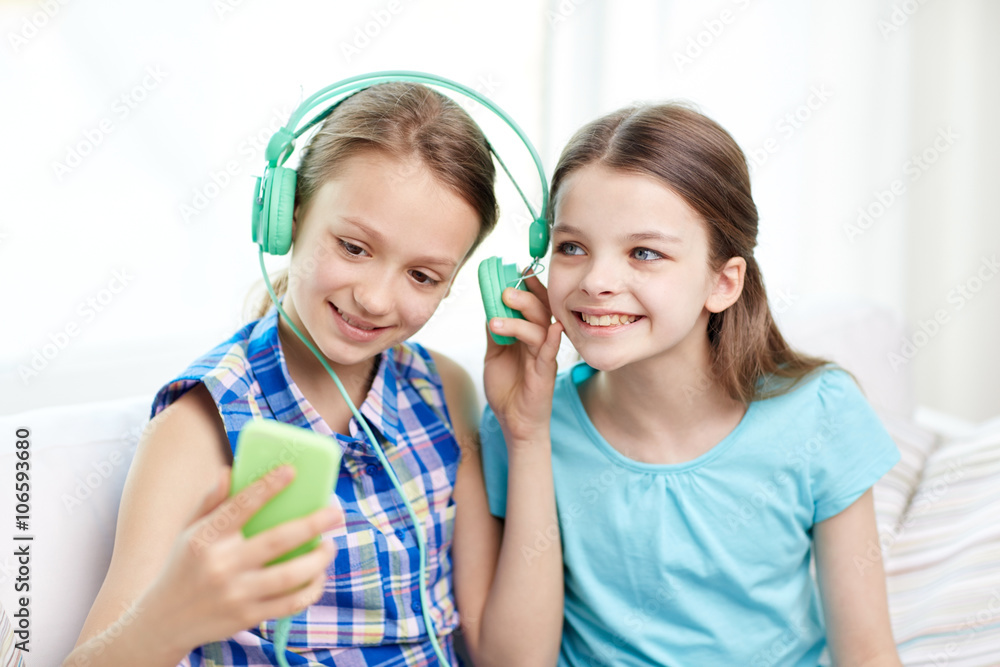 happy girls with smartphone and headphones happy girls with smartphone and headphones