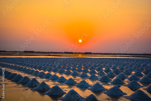 sunset over the salt field in thailand © sutthipong