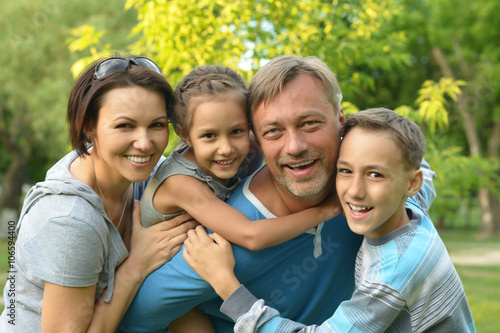 Family resting in  summer park